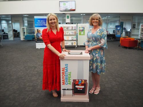 Image of Hawkesbury City Mayor Sarah McMahon and yourtown Acting National Manager for Child and Family Alison Schneidereit with the donation box at Hawkesbury Central Library.