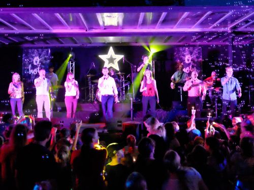 Picture of people on a stage for the event sponsorship program