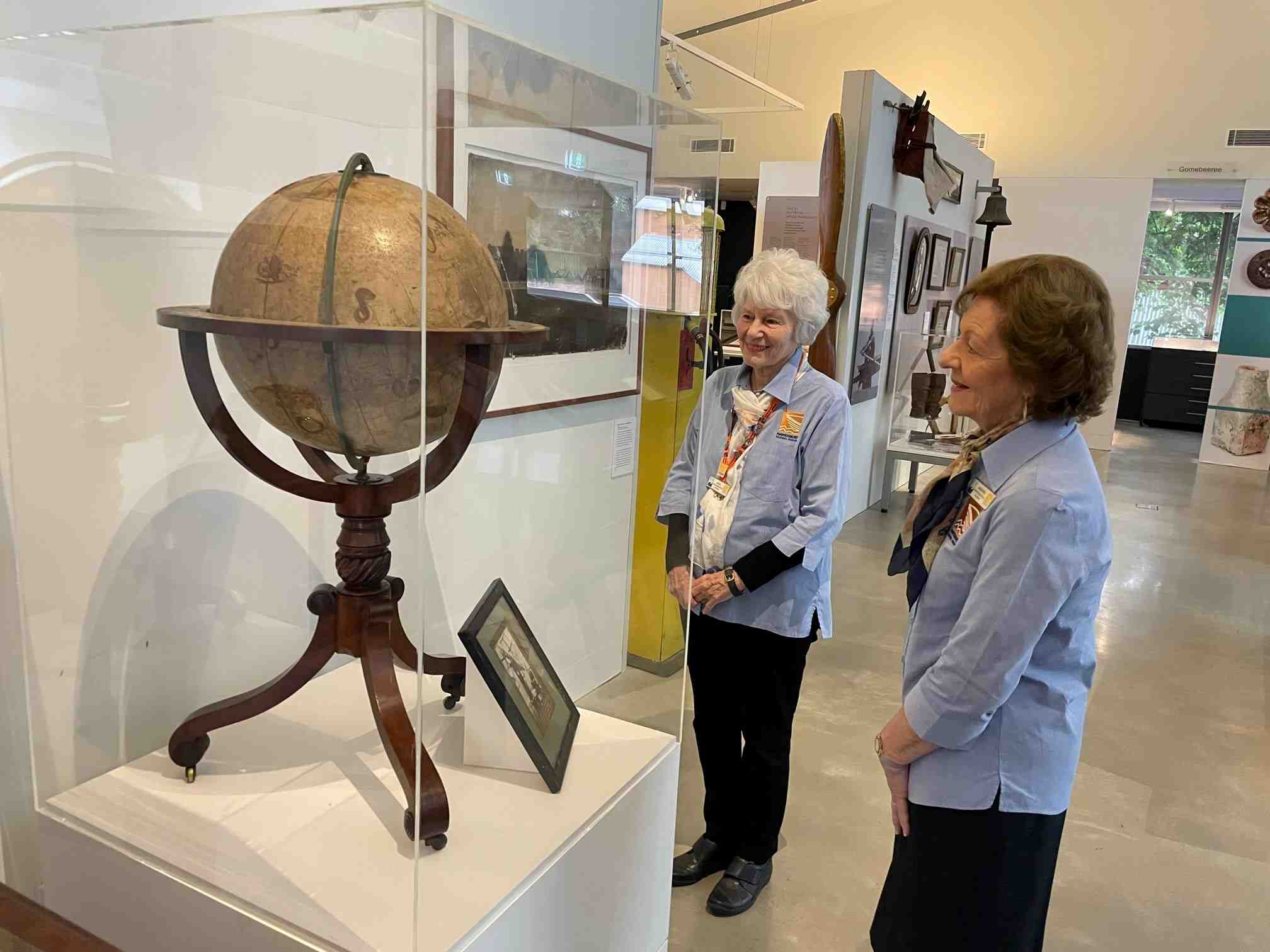 Judy and Jeanette looking at the Tebbutt Globe - Museum