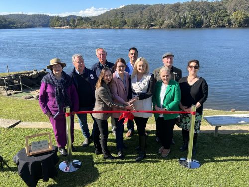 Image of officials cutting the ribbon at Greens Road 