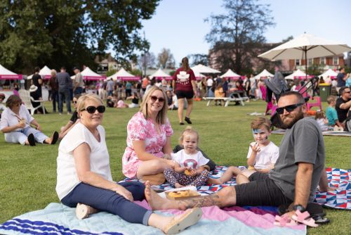 A picture of a family enjoying a picnic at Savour the Flavour.
