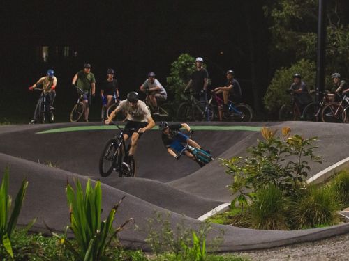 Picture of cyclists using a BMX pump track