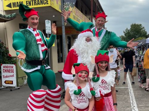 Picture of children with Santa and jumping elves