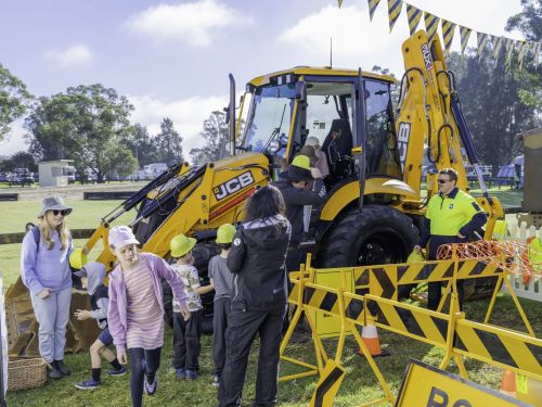 Young visitors take part in the construction zone obstacle course