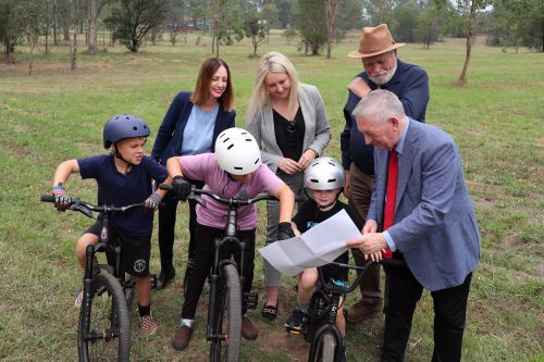 Photo of NSW MLC Peter Primrose (right) with NSW Member for Hawkesbury Robyn Preston, Hawkesbury City Mayor Sarah McMahon, Deputy Mayor Barry Calvert, and local BMX riders.