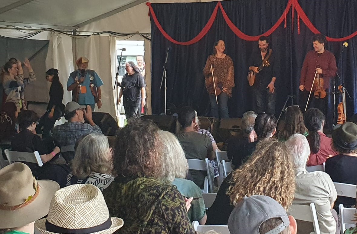 Musicians perform in a tent