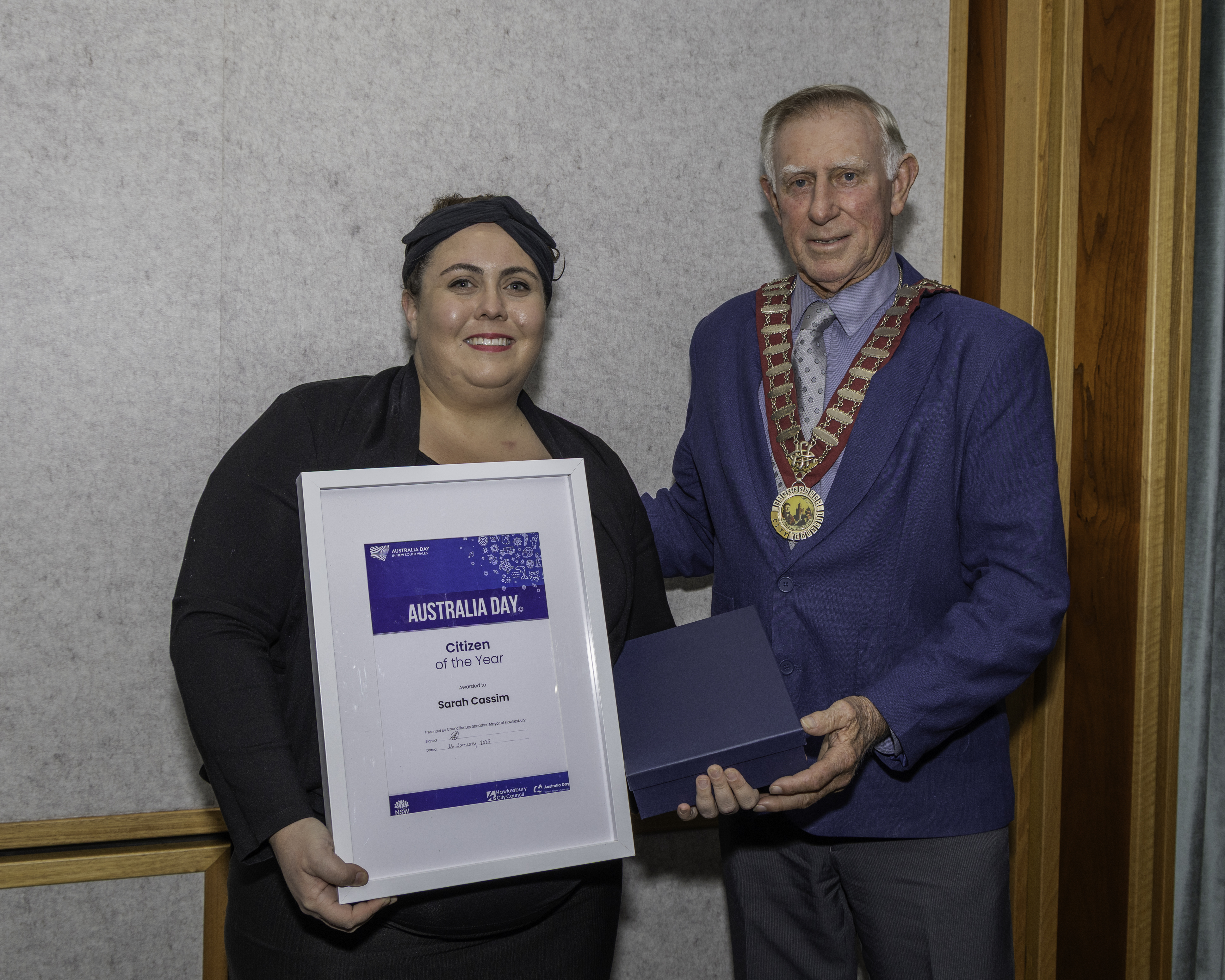 Sarah Cassim holds her Australia Day Award with Mayor Les Sheather